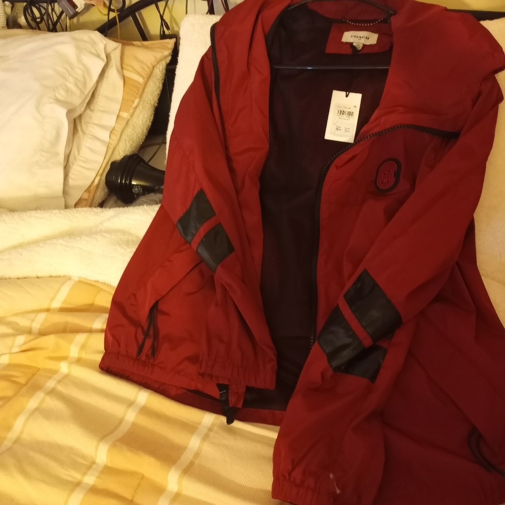 Coach jacket, windbreaker. Nice paid $300 selling for $180. Is new with tags.